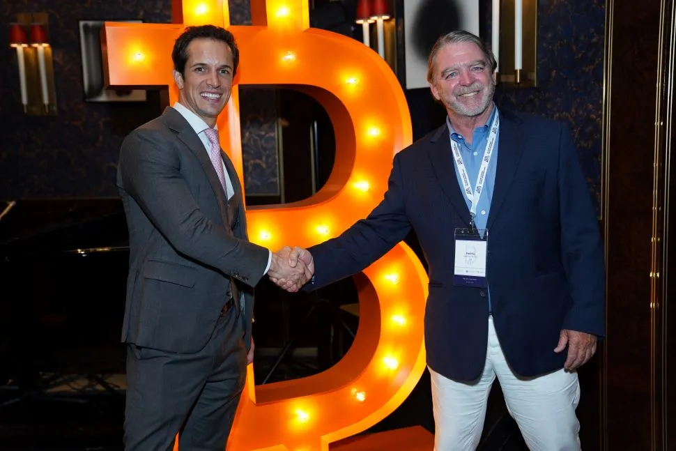 Zachary Cefaratti and Fred Pye, Chairman and CEO of 3iQ Corp.